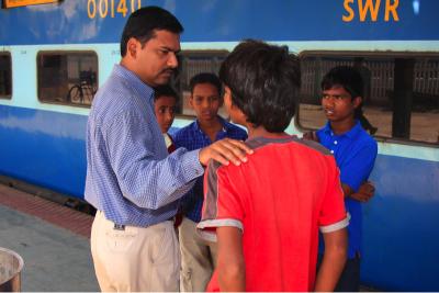 Talking to children on railway platform